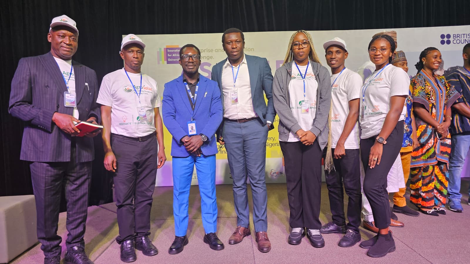 AgroSolar team on stage with partners at a British Council event in Ghana